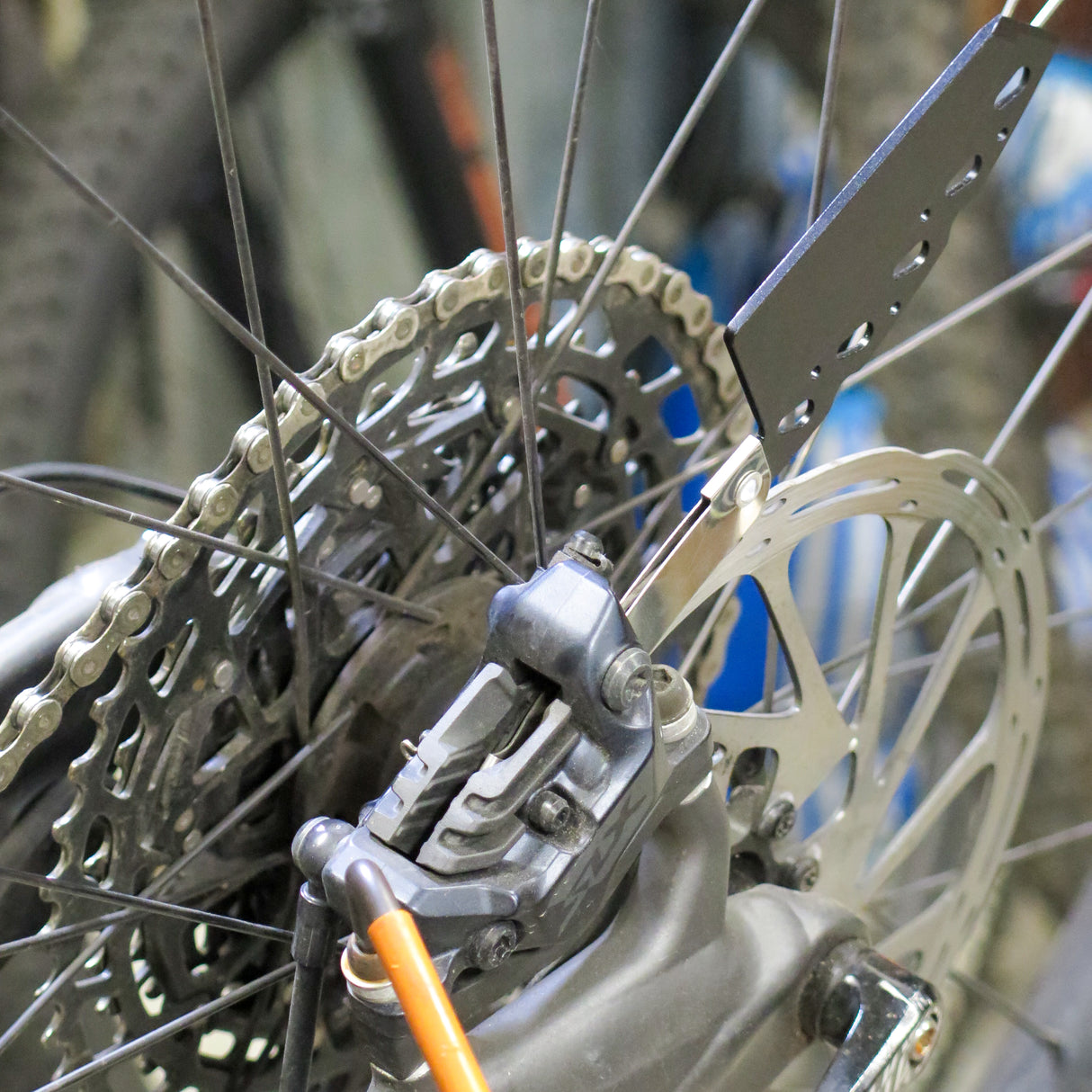 Beaut Bike Bicycle Disc Brake Caliper Alignment Tool being used to align a 4 piston Shimano SLX Hydraulic caliper.