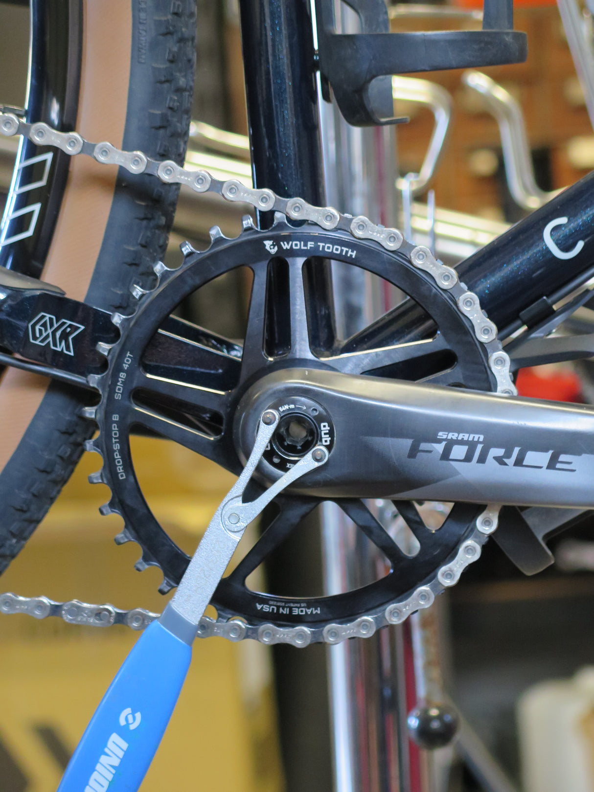 Unior Crank Cap Driver being used to remove and tighten a SRAM DUB Crank Cap on a carbon Force crankset