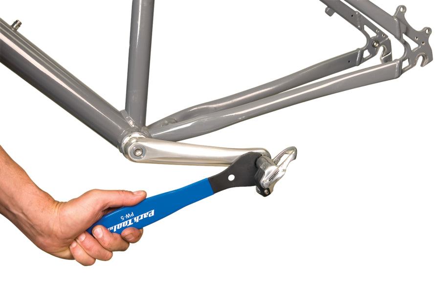 Park Tool PW-5 pedal wrench being used to remove clipless road pedal